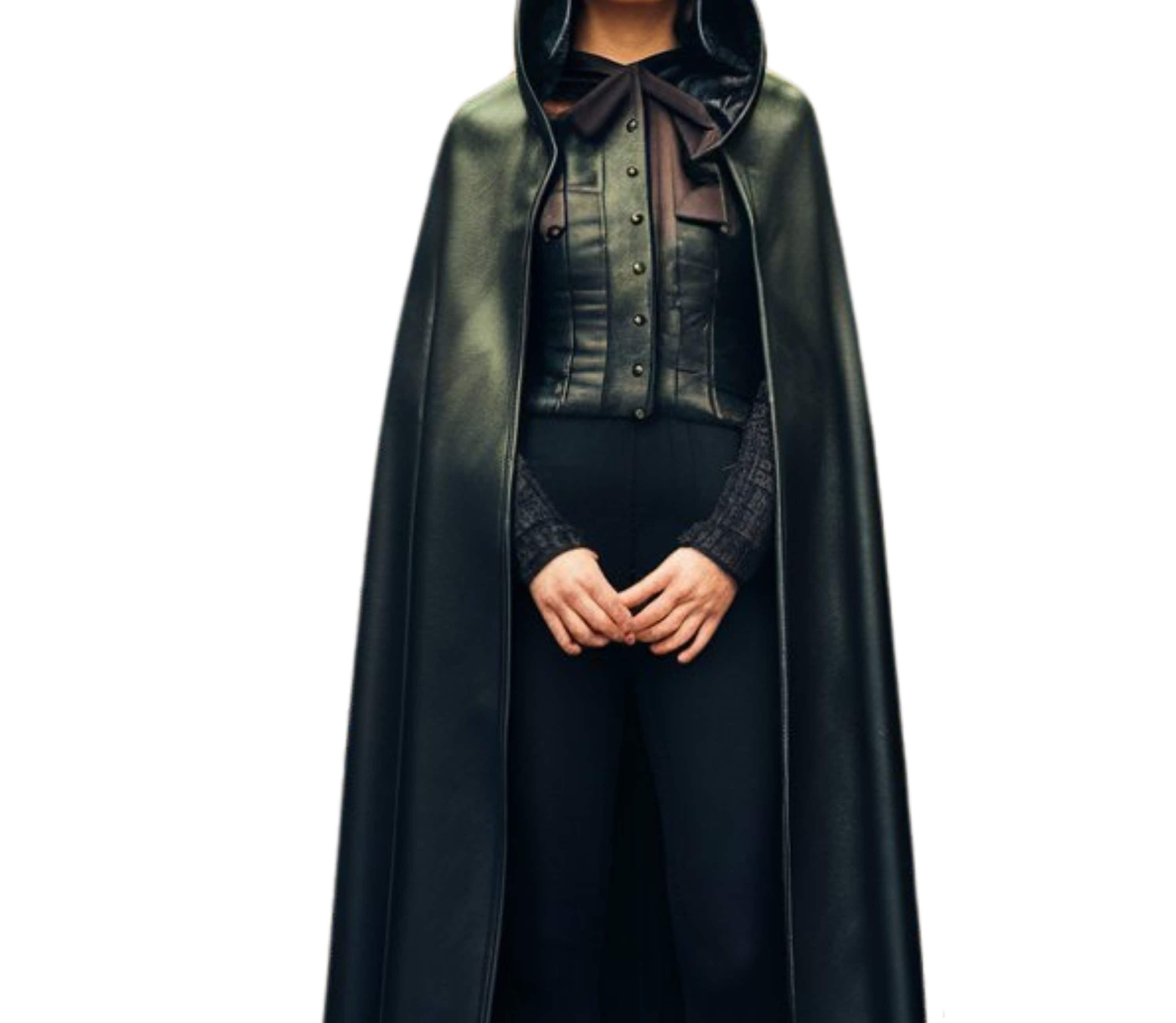 Close-up of leather hooded cape showing detailed stitching and soft faux leather texture for fantasy cosplay or steampunk cloak costume.